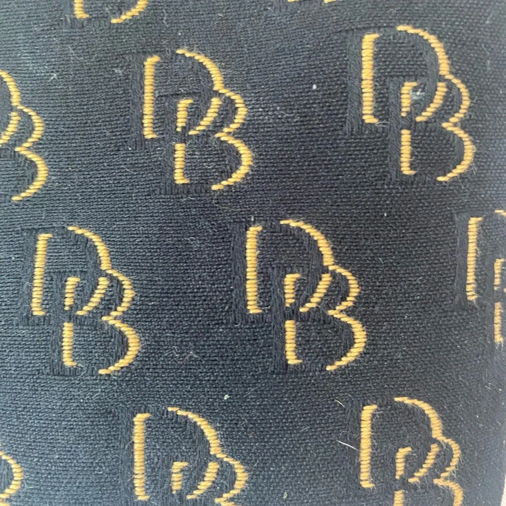 Dooney & Bourke Black and Gold Wristlet